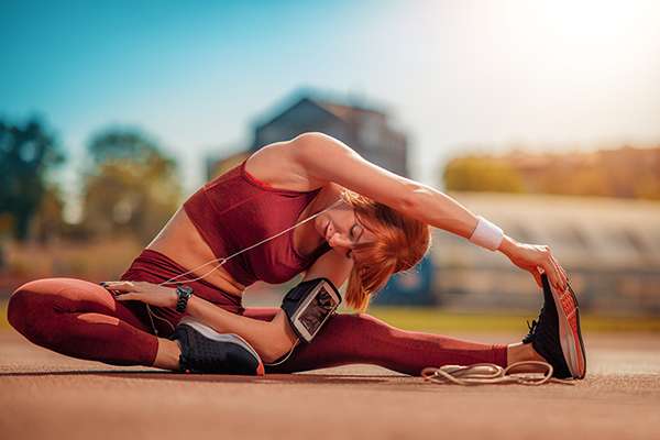 Woman performing yoga stretch without back pain